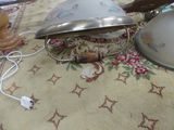 a silver tray sitting on top of a rug