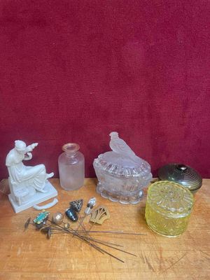 a lot of glass items on a table with a red background