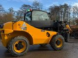 a picture of a forklift truck parked in a parking lot