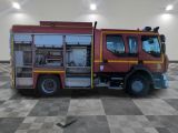 a fire truck that is parked in a room