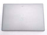 dell laptop computer sitting on top of a white table next to a keyboard