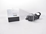 a black and white photo of a camera and a box