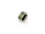 a close up of a green and black ring on a white surface