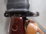 a close up of a wooden handle on a skateboard