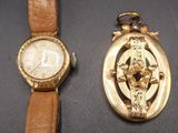 two watches sitting next to each other on a table