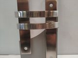 a pair of metal latches that are attached to a wall