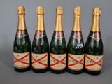 six bottles of champagne are lined up in a row