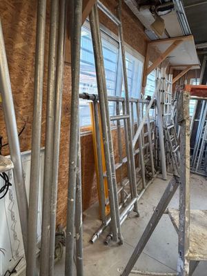 a room with scaffolding and a window in it