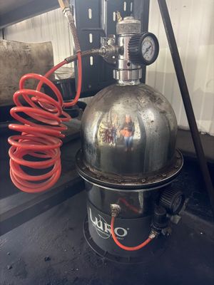an image of a proprigerator with a hose attached to it