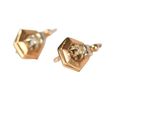 pair of gold earrings with pearls on a white background