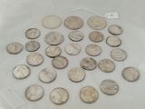 a lot of coins that are on the table