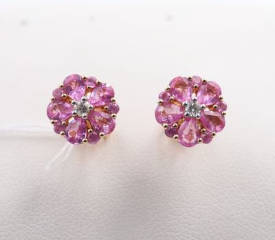 a pair of pink sapphire and diamond stud earrings