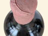 a bottle of wine with a cork sticking out of it