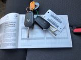 a book with a bunch of car keys on top of it