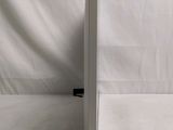 an image of a white table with a laptop on top of it