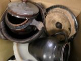 many pots and pans that are in a box