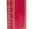 a red book with gold trim and a gold border