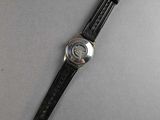 an image of a watch on a table with a white background