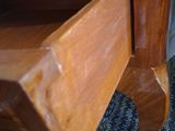 a wooden table with a drawer on top of it