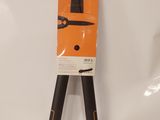 an orange and black pair of pliers on a white surface