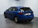 the rear end of a blue car parked in a garage