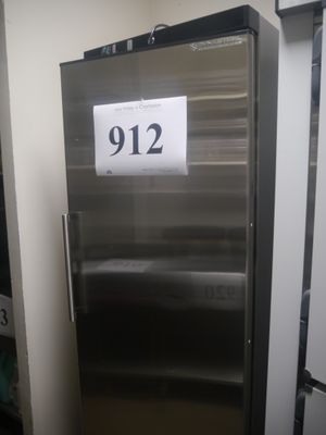 a stainless steel refrigerator that has a price tag on it