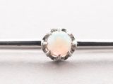 a close up of a ring with an oplite stone on it