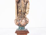 an image of a statue of a woman holding a baby in her arms