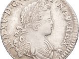 une pièce d'argent portant une tête de femme et une couronne