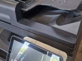 an image of a multi - function printer in a garage