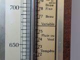 a thermometer on the wall showing the temperature of the room