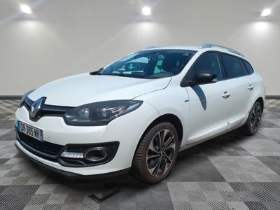 a white car parked in a room with a checkered floor