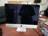 a computer monitor sitting on a desk in front of a computer monitor