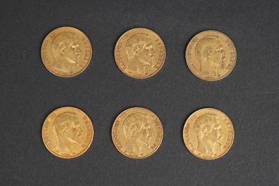 six gold sovereigns, one of which has a head and four of which have a crown on them