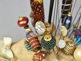 a vase with a bunch of different colored beads on it