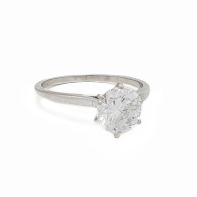 a close up of a diamond ring on a white background