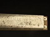 a close up of a metal plate with writing on it