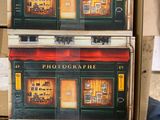 three boxes of photographs on display in a store