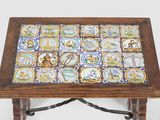 a wooden table with a tile top on it