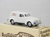 a small white toy ambulance on a box