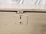 a white box with a lock on the inside of it