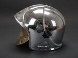 a silver helmet with a gold leaf on the side of it