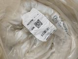 a plastic bag with a label on it sitting on a table