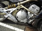 a close up of a motorcycle parked in a parking lot