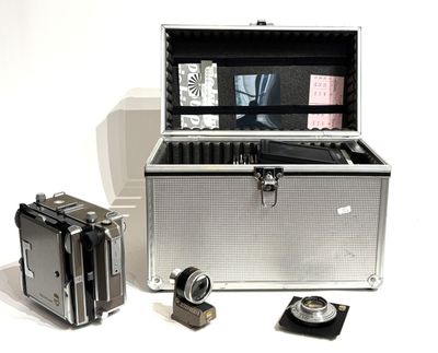 a silver box with a camera and some other items
