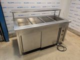 an image of a stainless steel counter with two sinks and a hose