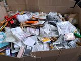 a cardboard box filled with many different types of items