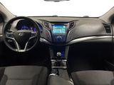 the interior of a car with a steering wheel, dashboard, and dashboard lights