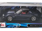 black toy car with red interior in a box on a white background