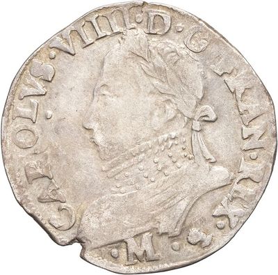 a silver coin with an image of a woman wearing a tia